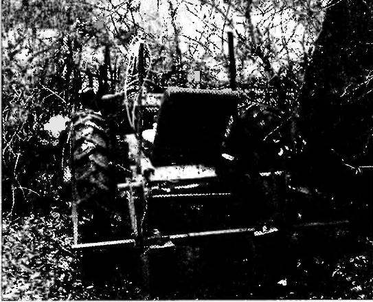 Agricultural implement mounted on the frame of the tractor.