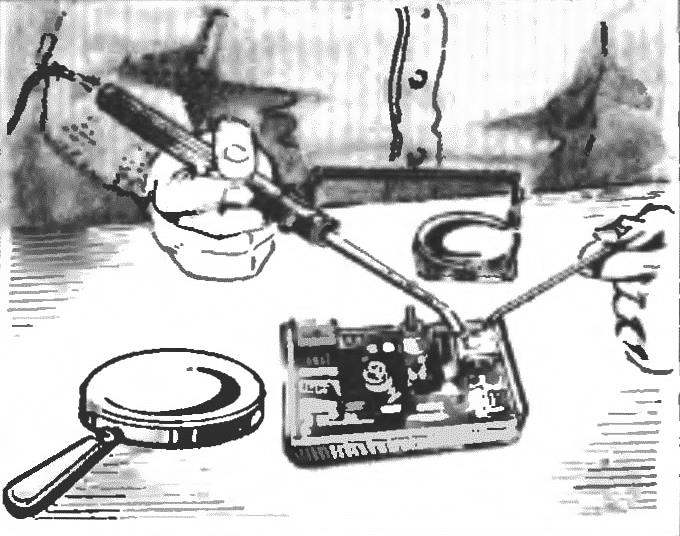 SOLDERING UNDER A MAGNIFYING GLASS