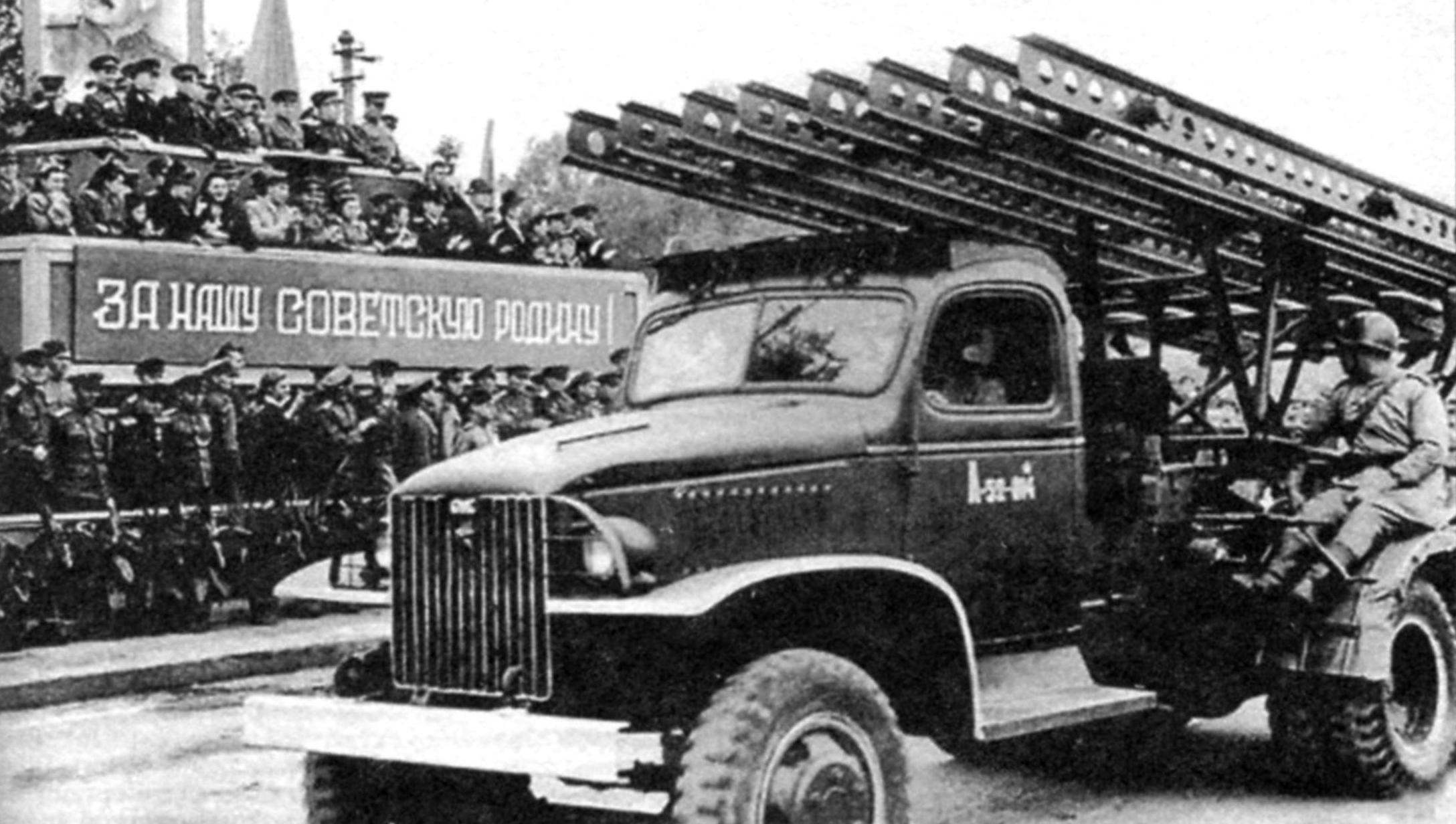 Installing the BM-13 on the chassis of the American truck military vehicle GМС ССКW-353 (2x4) on one of the parades in Germany. 1945.