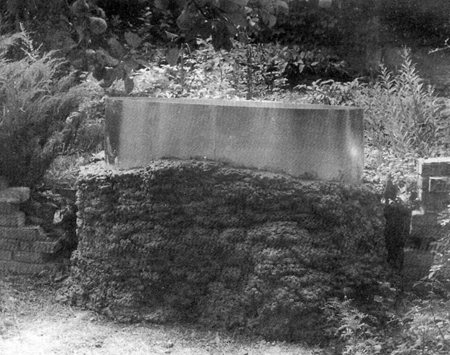 Intermediate stage of building the reservoir walls: view from the lower terrace