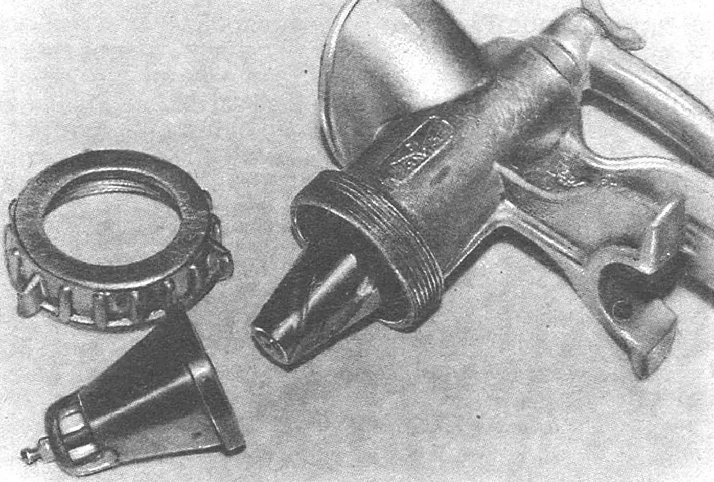 This simple attachment for an ordinary meat grinder turns it into a miniature flour-milling “unit”.