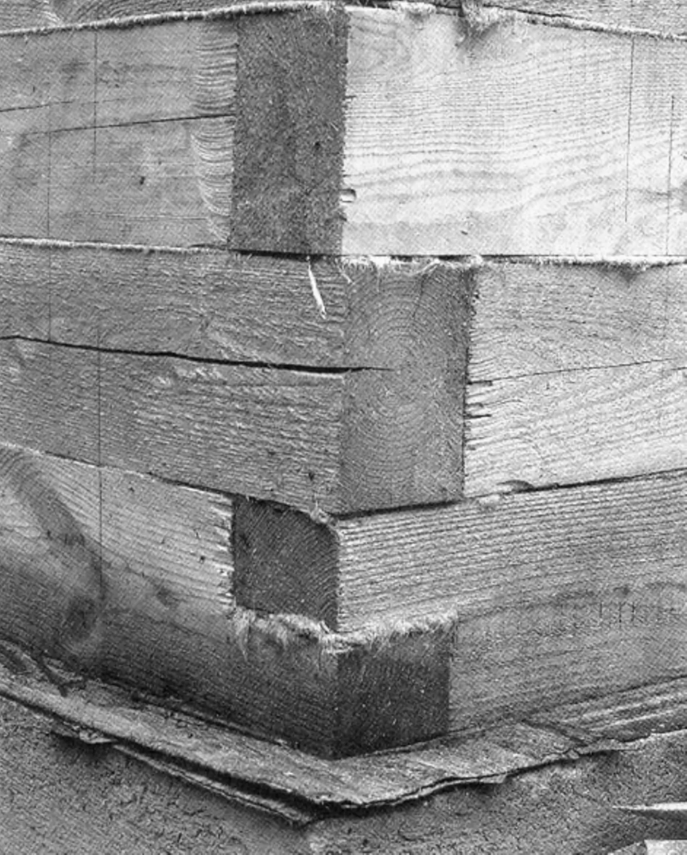 Tie beams at the corners are half-lap joined, later rows overlapped and doweled