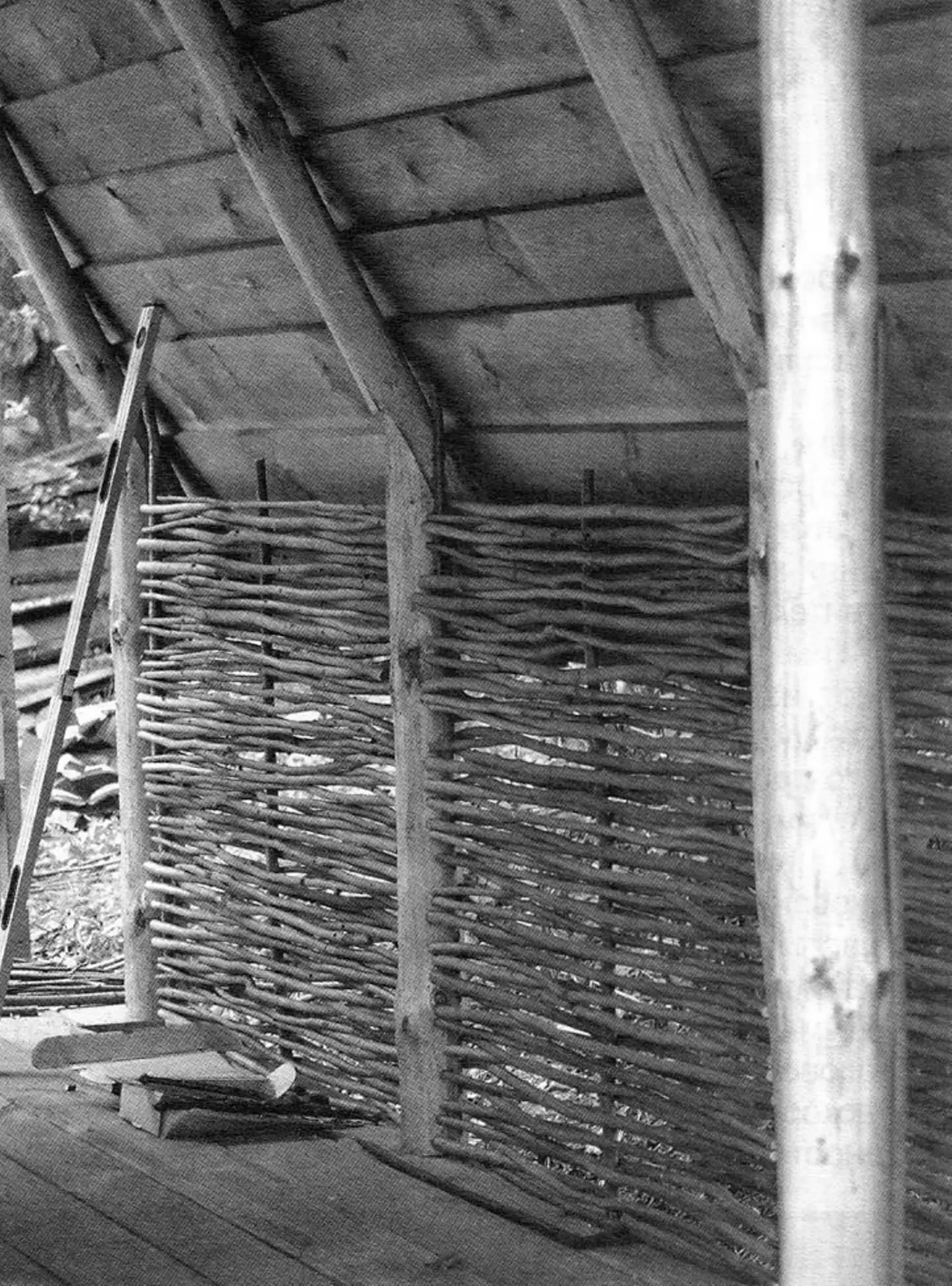 Wattle branch infill along hut walls