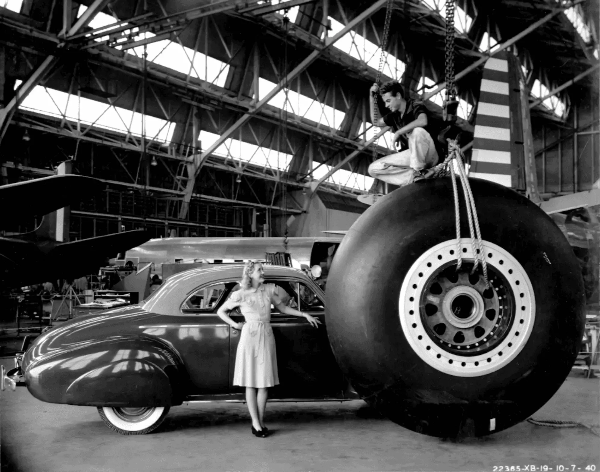 Photographers loved shooting the giant eight-foot main wheels of the XB-19—often with women and cars for scale