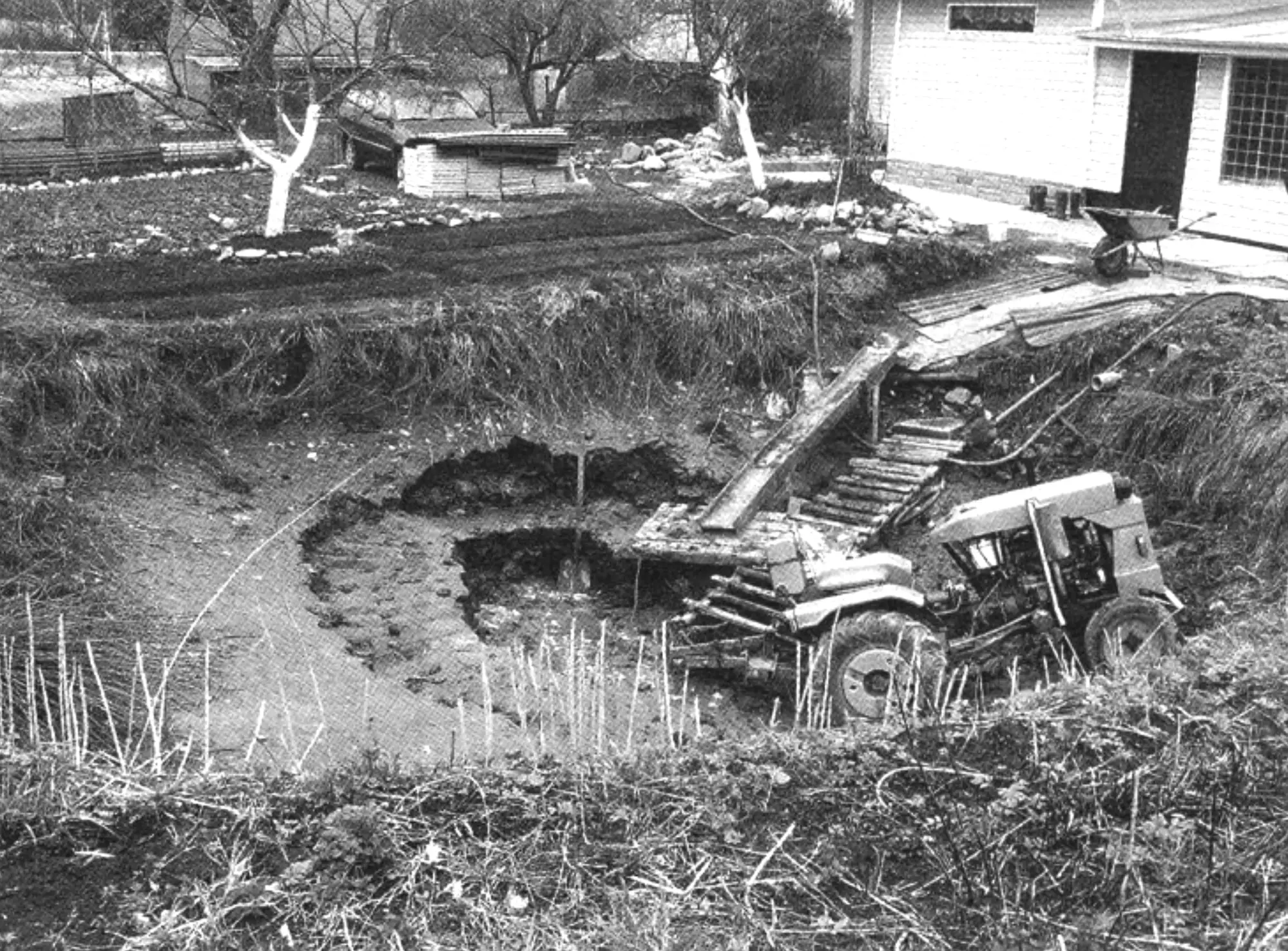 Removing silt from the bottom of the pond bowl