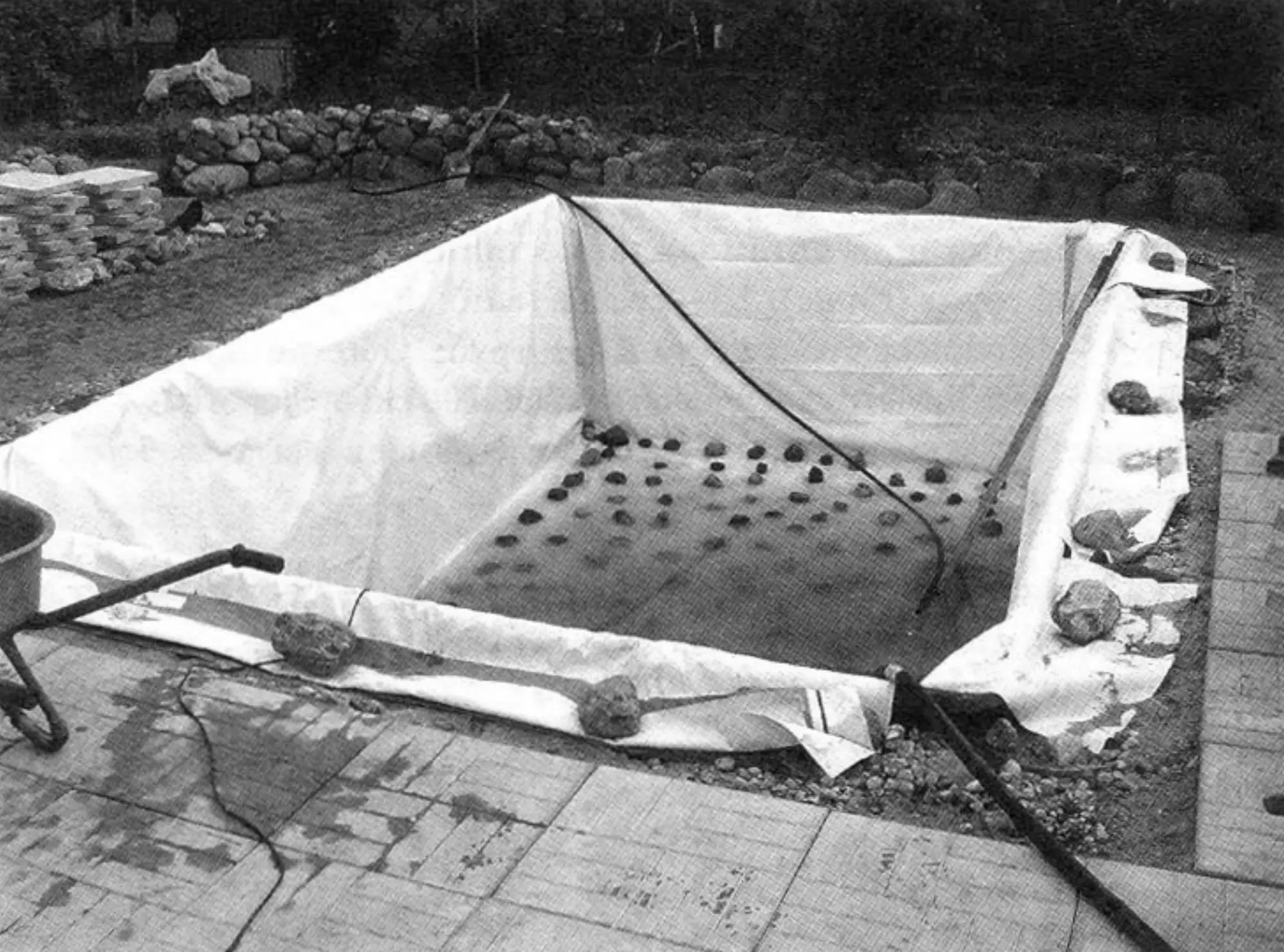 Trial filling of the new pool with water and testing the vinyl lining for tightness