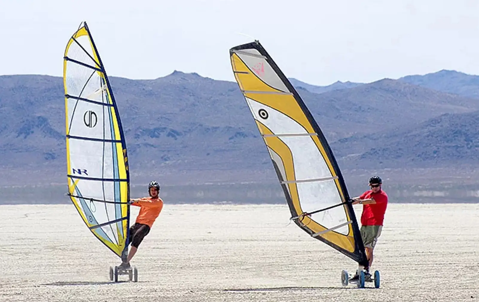 Riding wheeled windsurfers on the bed of a dry lake