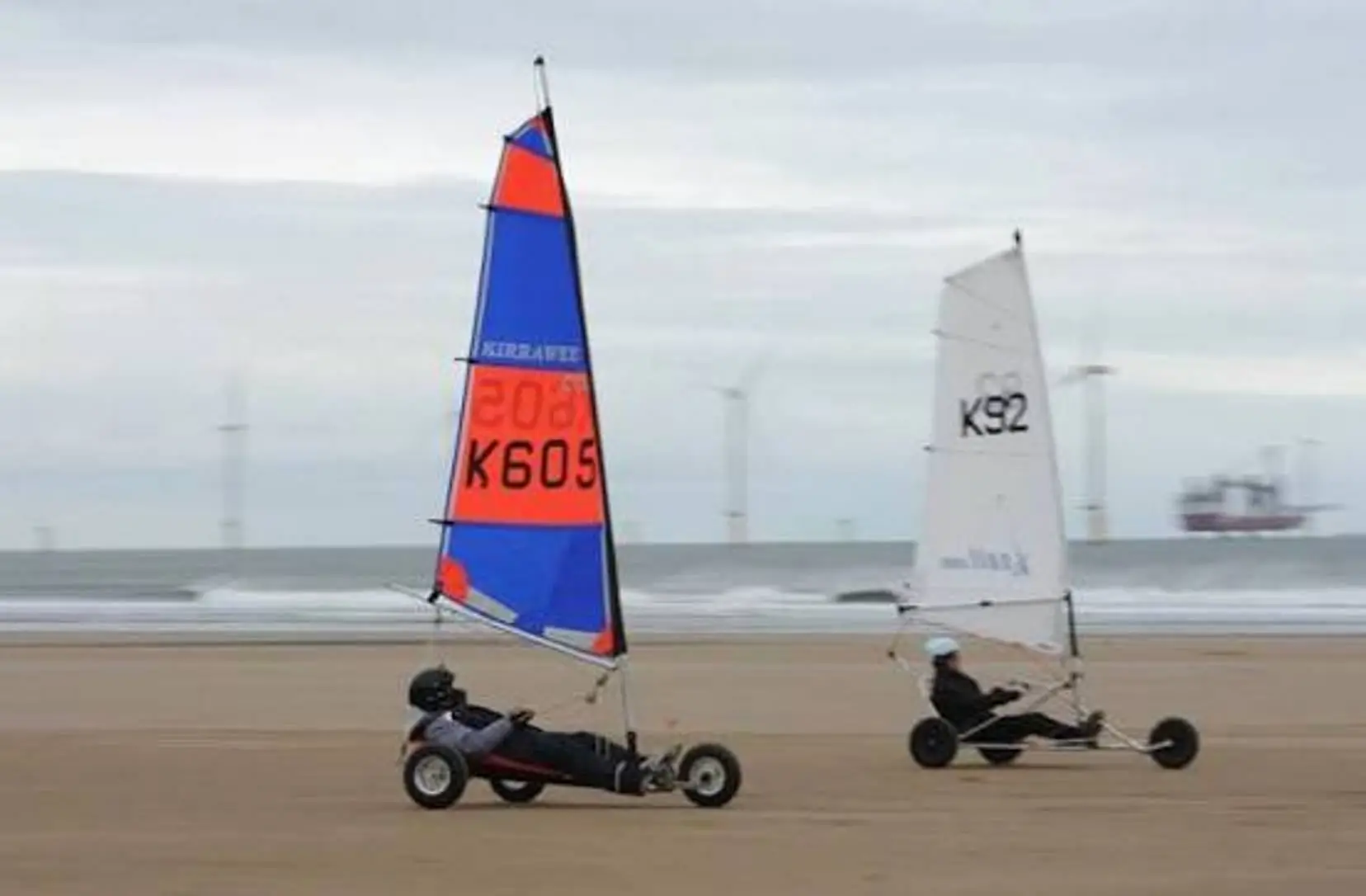 Land sailer race along the shoreline (England)